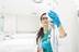 Healthcare worker checking fluids in drip line