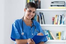 Nurse student taking notes in library